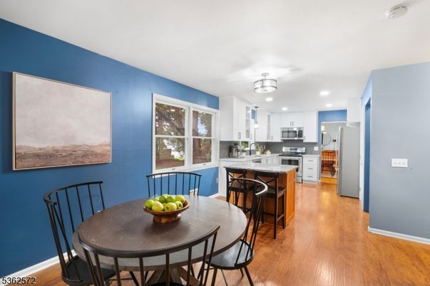 Dining room, Interior, Kitchen, Recessed Lighting, Stainless Steel Appliances, Wood Texture Flooring