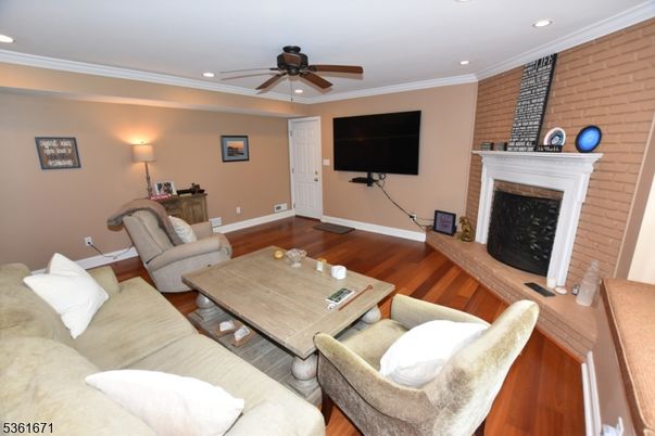 Fireplace, Interior, Living room, Recessed Lighting, Stone Walls, Wood Texture Flooring