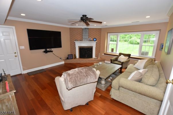 Fireplace, Interior, Living room, Recessed Lighting, Stone Walls, Wood Texture Flooring