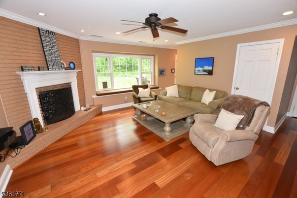 Fireplace, Interior, Living room, Recessed Lighting, Stone Walls, Wood Texture Flooring
