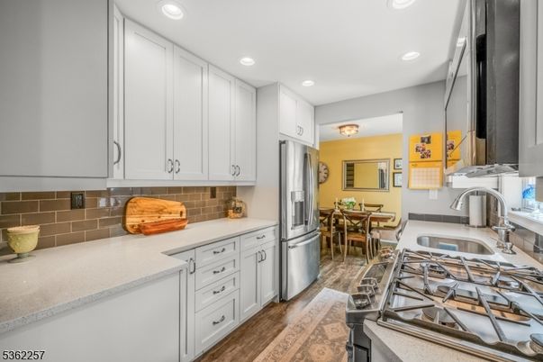 Dining room, Interior, Kitchen, Recessed Lighting, Stainless Steel Appliances, Wood Texture Flooring