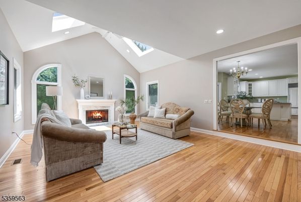 Chandelier, Dining room, Fireplace, Interior, Kitchen, Living room, Recessed Lighting, Wood Texture Flooring