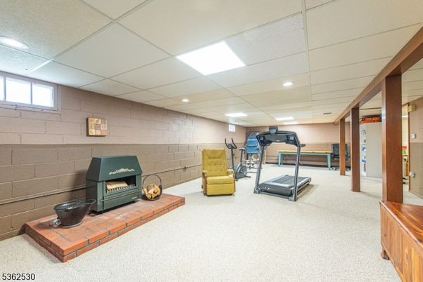 Fireplace, Fitness Equipment, Interior, Recessed Lighting, Stone Walls