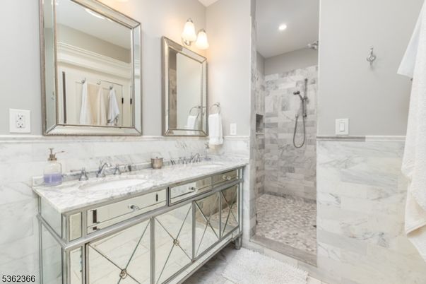 Bathroom, Dual Sink Vanities, Glass Shower, Interior, Marble, Marble Walls, Recessed Lighting
