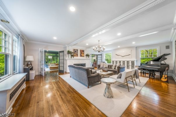 Chandelier, Fireplace, Interior, Living room, Piano, Recessed Lighting, Wood Texture Flooring