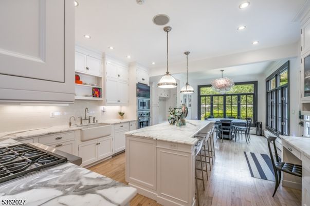 Chandelier, Dining room, Interior, Kitchen, Pendant Lights, Recessed Lighting, Stainless Steel Appliances, Wood Texture Flooring