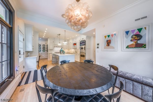 Chandelier, Dining room, Interior, Kitchen, Pendant Lights, Recessed Lighting, Stainless Steel Appliances, Wood Texture Flooring