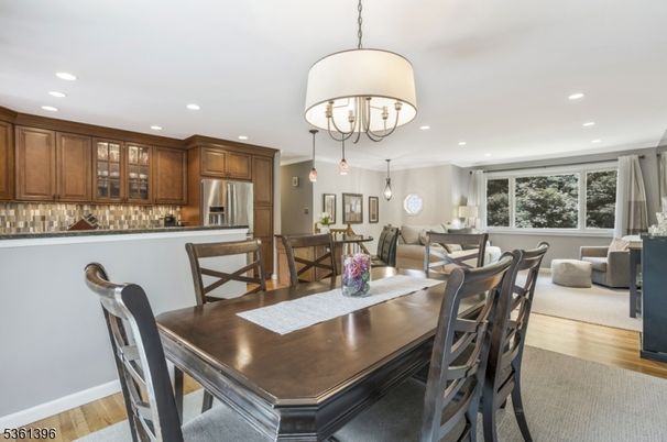 Chandelier, Dining room, Interior, Kitchen, Recessed Lighting, Stainless Steel Appliances, Wood Texture Flooring
