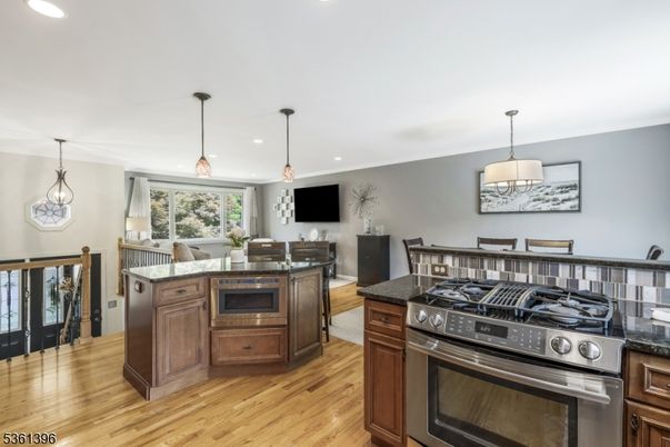 Dining room, Interior, Kitchen, Pendant Lights, Recessed Lighting, Stainless Steel Appliances, Wood Texture Flooring