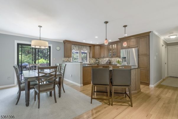 Dining room, Interior, Kitchen, Pendant Lights, Recessed Lighting, Stainless Steel Appliances, Wood Texture Flooring