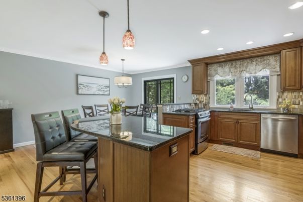 Dining room, Interior, Kitchen, Pendant Lights, Recessed Lighting, Stainless Steel Appliances, Wood Texture Flooring
