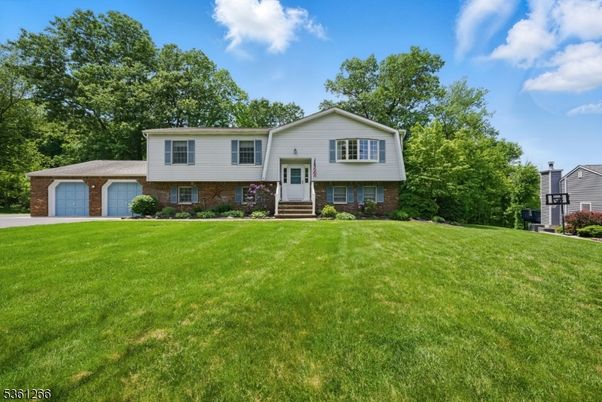 Attached, Backyard, Exterior, Facade, Brick Facade, Raised Ranch