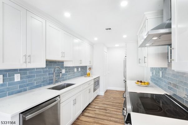 Interior, Kitchen, Recessed Lighting, Stainless Steel Appliances, Wood Texture Flooring