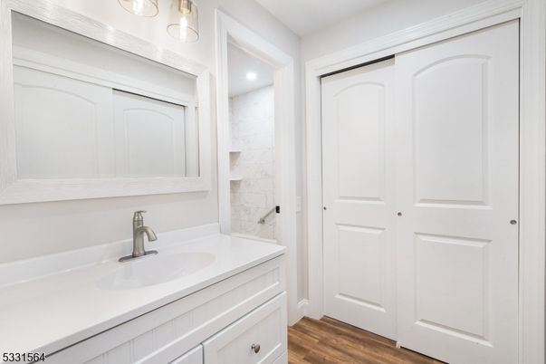 Bathroom, Interior, Marble Walls, Recessed Lighting, Wood Texture Flooring
