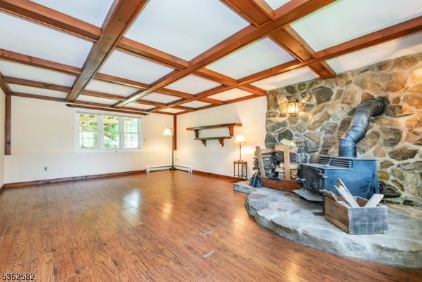 Empty room, Fireplace, Interior, Stone Walls, Wooden Beams, Wood Texture Flooring