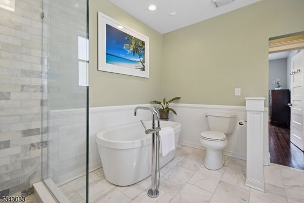 Bathroom, Free Standing Baths, Glass Shower, Interior, Marble, Recessed Lighting, Wood Texture Flooring