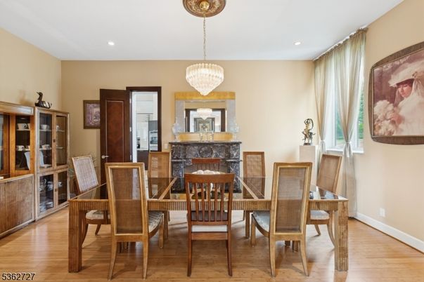 Chandelier, Dining room, Fireplace, Interior, Recessed Lighting, Wood Texture Flooring