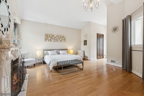 Bedroom, Chandelier, Fireplace, Interior, Wood Texture Flooring