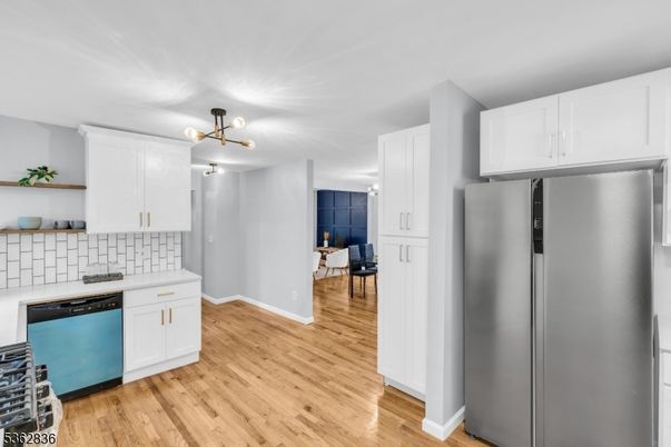 Interior, Kitchen, Stainless Steel Appliances, Tile Countertops, Wood Texture Flooring