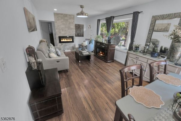 Dining room, Fireplace, Interior, Living room, Pendant Lights, Recessed Lighting, Wood Texture Flooring