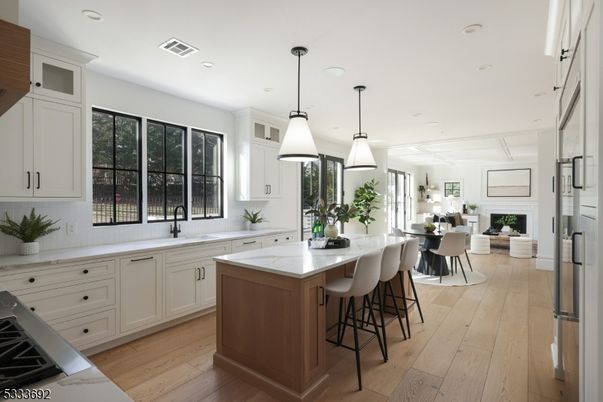 Dining room, Fireplace, Interior, Kitchen, Pendant Lights, Recessed Lighting, Wood Texture Flooring