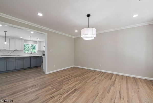 Empty room, Interior, Kitchen, Marble Walls, Pendant Lights, Recessed Lighting, Wood Texture Flooring