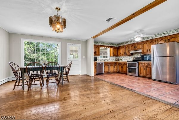 Chandelier, Dining room, Interior, Kitchen, Stainless Steel Appliances, Wood Texture Flooring