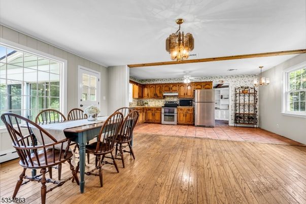Chandelier, Dining room, Interior, Kitchen, Stainless Steel Appliances, Wood Texture Flooring