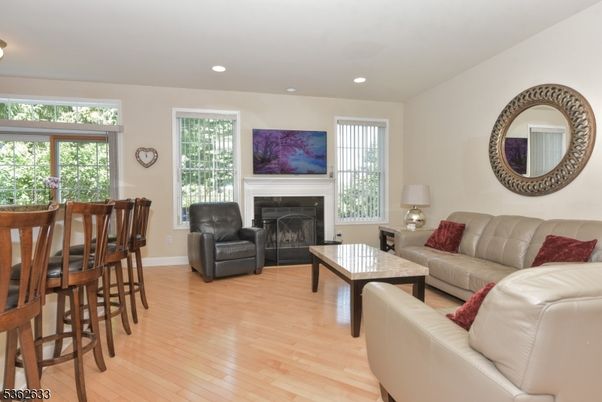 Dining room, Fireplace, Interior, Living room, Recessed Lighting, Wood Texture Flooring