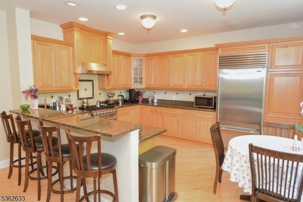 Dining room, Interior, Kitchen, Recessed Lighting, Stainless Steel Appliances, Wood Texture Flooring