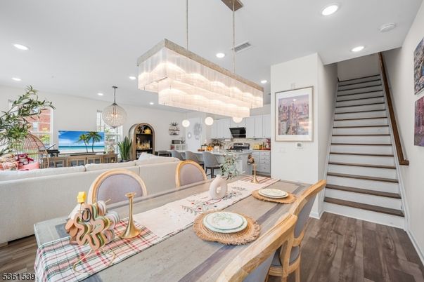 Chandelier, Dining room, Interior, Kitchen, Living room, Pendant Lights, Recessed Lighting, Stainless Steel Appliances, Wood Texture Flooring
