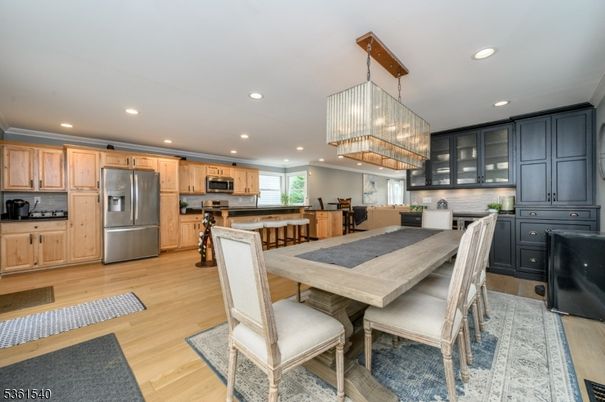 Chandelier, Dining room, Interior, Kitchen, Recessed Lighting, Stainless Steel Appliances, Wood Texture Flooring