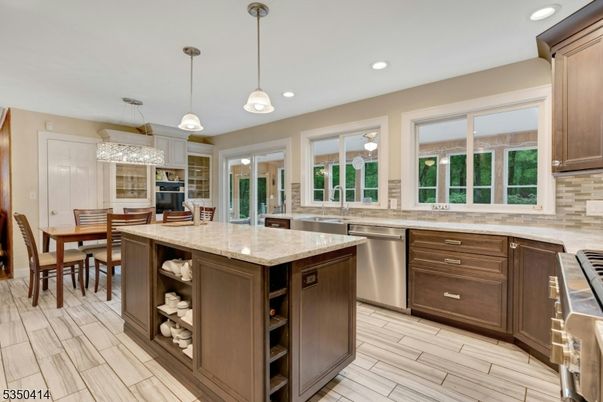 Chandelier, Dining room, Interior, Kitchen, Pendant Lights, Recessed Lighting, Stainless Steel Appliances, Wood Texture Flooring