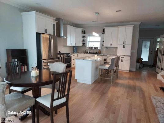 Dining room, Interior, Kitchen, Recessed Lighting, Stainless Steel Appliances, Wood Texture Flooring