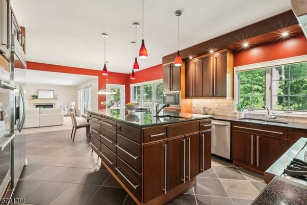 Dining room, Fireplace, Interior, Kitchen, Pendant Lights, Recessed Lighting, Stainless Steel Appliances