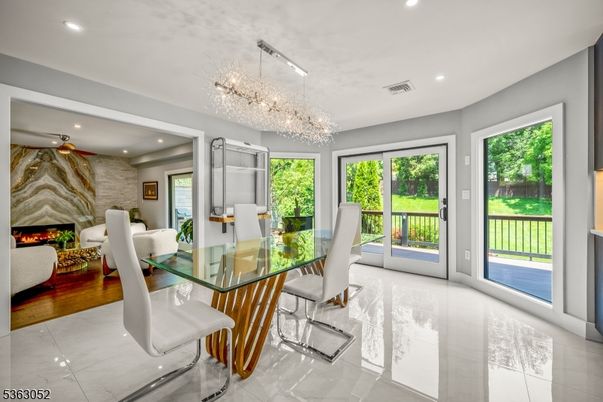 Chandelier, Dining room, Fireplace, Interior, Living room, Recessed Lighting, Wood Texture Flooring