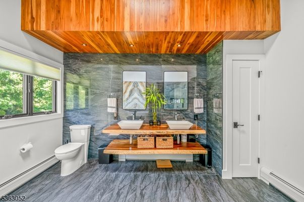 Bathroom, Dual Sink Vanities, Glass Shower, Interior, Marble, Marble Walls, Recessed Lighting, Wooden Ceilings