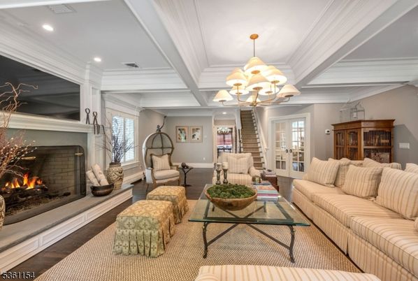 Chandelier, Fireplace, Interior, Living room, Recessed Lighting, Wood Texture Flooring