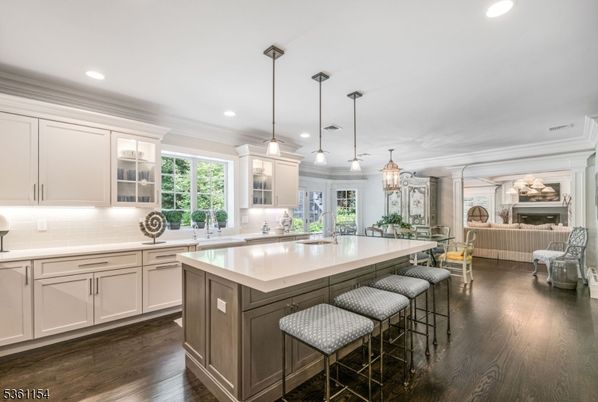 Chandelier, Fireplace, Interior, Kitchen, Living room, Pendant Lights, Recessed Lighting, Wood Texture Flooring