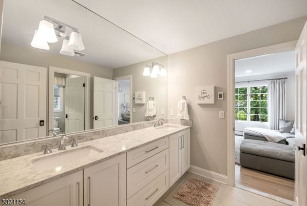 Bathroom, Dual Sink Vanities, Interior, Recessed Lighting, Wood Texture Flooring