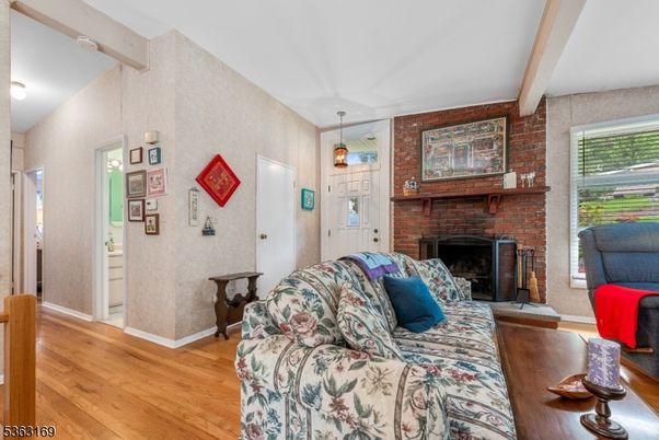 Fireplace, Interior, Living room, Pendant Lights, Stone Walls, Wood Texture Flooring