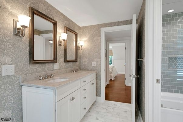 Bathroom, Dual Sink Vanities, Interior, Marble, Recessed Lighting, Wood Texture Flooring