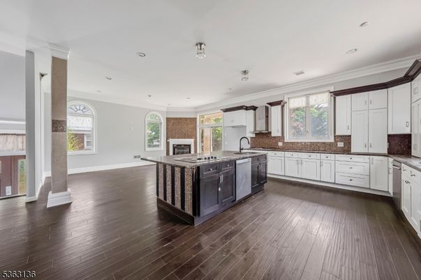 Fireplace, Interior, Kitchen, Recessed Lighting, Stainless Steel Appliances, Wood Texture Flooring