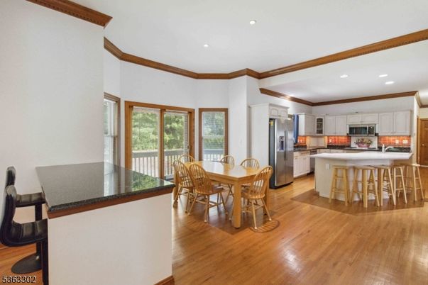 Dining room, Interior, Kitchen, Recessed Lighting, Stainless Steel Appliances, Wood Texture Flooring