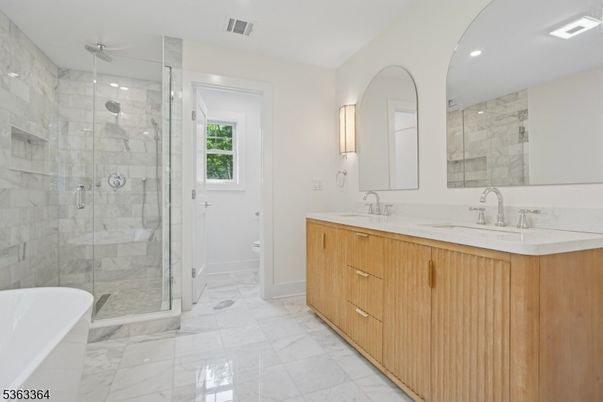 Bathroom, Dual Sink Vanities, Glass Shower, Interior, Marble, Marble Walls, Recessed Lighting