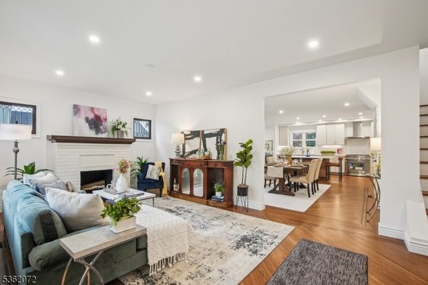 Dining room, Fireplace, Interior, Kitchen, Living room, Recessed Lighting, Wood Texture Flooring