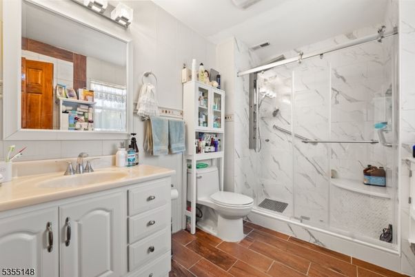 Bathroom, Glass Shower, Interior, Marble Walls, Wood Texture Flooring