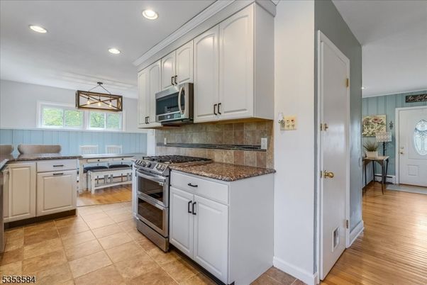 Dining room, Interior, Kitchen, Pendant Lights, Recessed Lighting, Stainless Steel Appliances, Wood Texture Flooring