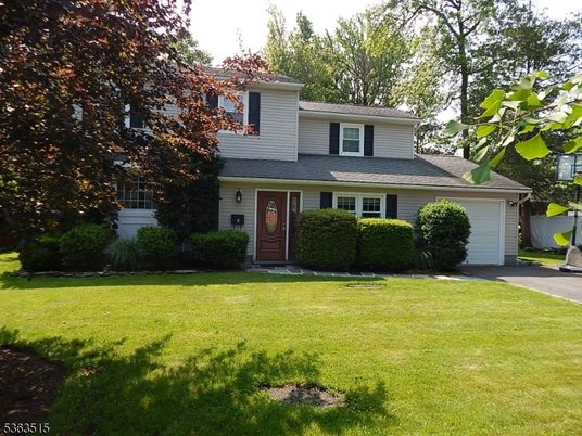 Attached, Backyard, Exterior, Facade, Brick Facade, Split Level