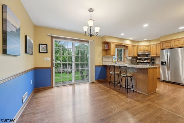 Chandelier, Interior, Kitchen, Recessed Lighting, Stainless Steel Appliances, Wood Texture Flooring